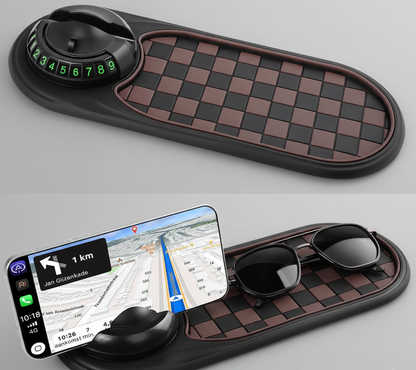 Car dashboard organizer with phone holder, sunglasses, and compass on a gray background