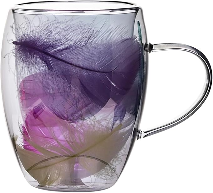 Clear glass mug with purple feathers inside on a white background