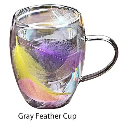  glass mug with Gray feathers inside 